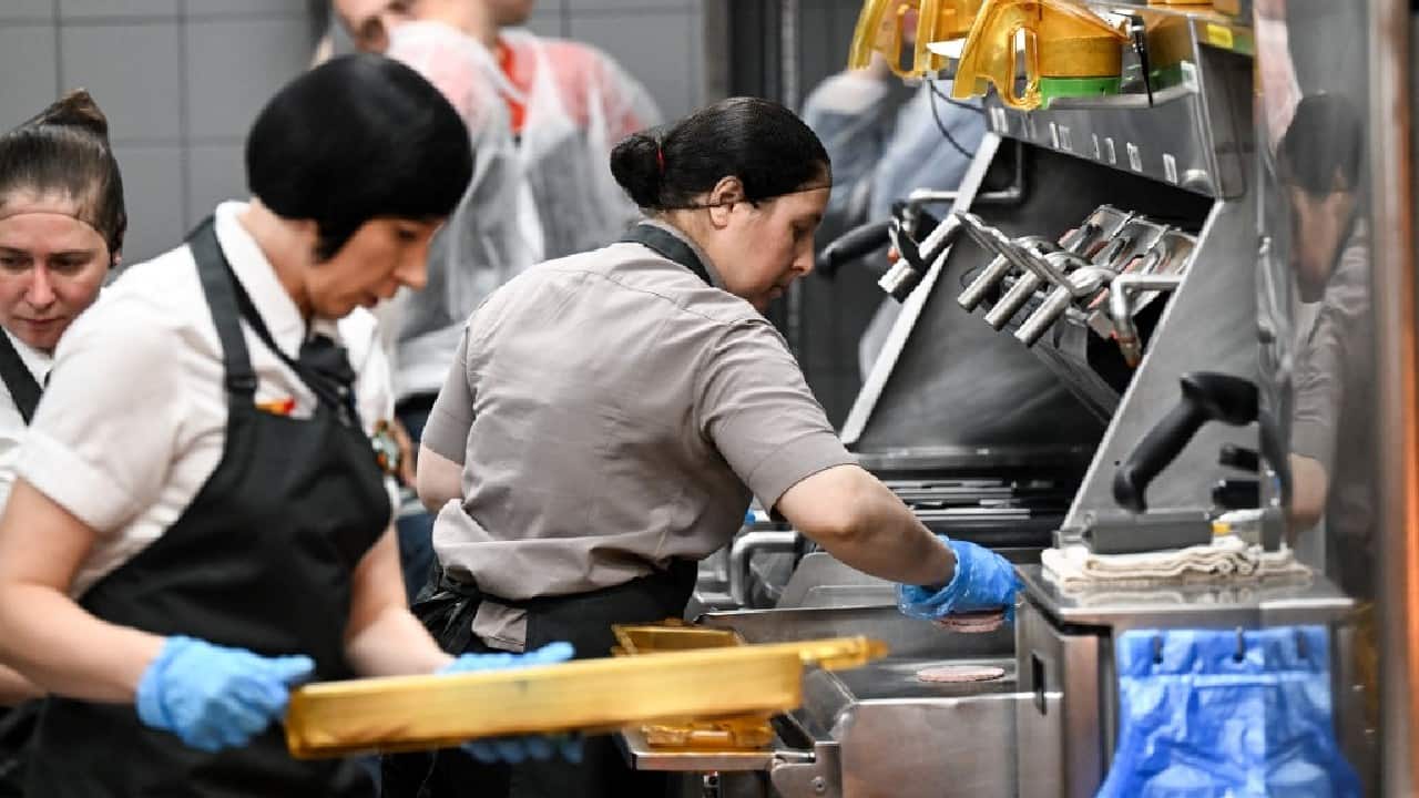 The restaurant, on the spot where the very first McDonald's opened its doors to long queues and great fanfare in January 1990, is among the first 15 to welcome customers. (Image: AFP)