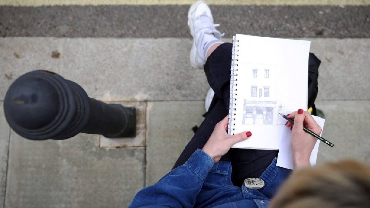 The central London pub in a historic 19th-century building has had a colourful clientele, including journalists from satirical magazine Private Eye. Other regulars included the legendary alcoholic newspaper columnist Jeffrey Bernard, who was immortalised in a Keith Waterhouse play &quot;Jeffrey Bernard Is Unwell&quot;. It is now managed by a brewery chain. On a Saturday afternoon, there is a constant stream of passers-by and drinkers sit with pints outside. &quot;That took nearly three hours,&quot; she said of her finished drawing of an &quot;iconic part of Soho&quot;. &quot;It's funny -- there are so many people around, but actually it felt quite a peaceful drawing.&quot; (Image: AFP)
