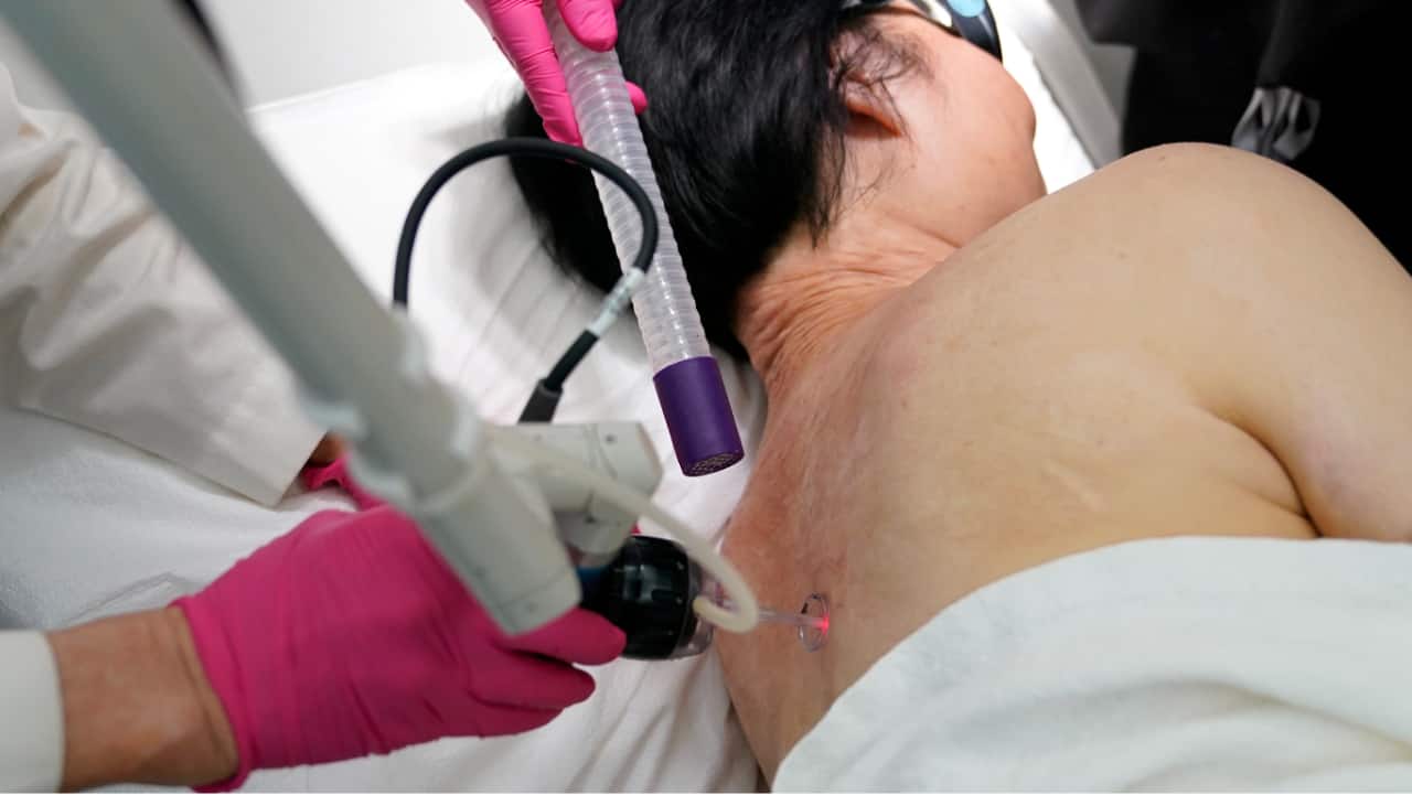 Kim Phuc receives a laser treatment by Dr. Jill Waibel at the Miami Dermatology and Laser Institute.