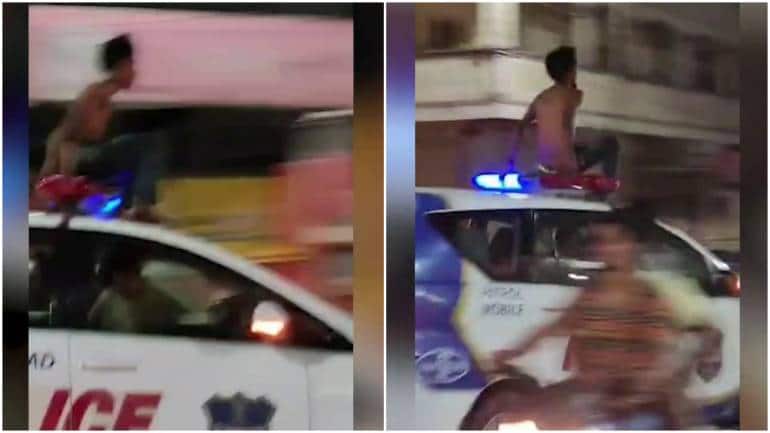 Watch: Drunk man climbs on top of police car, goes for joyride in Hyderabad