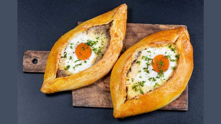 khachapuri is georgia's poster child for bread - shaped liked a boat, it is filled with cheese and has a very 'grammable egg in the middle. 