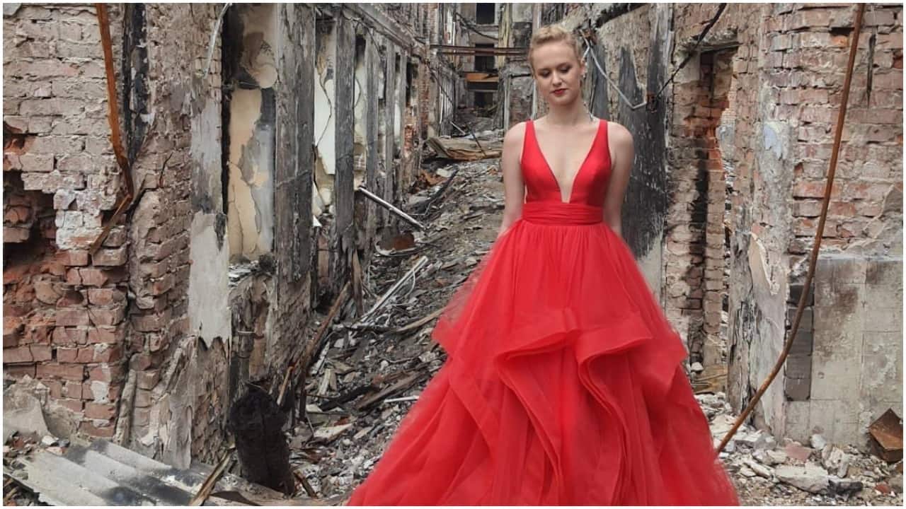 Ukraine teen poses in graduation dress in front of bombed school in powerful picture