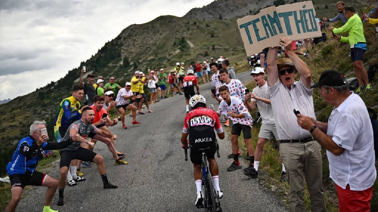 Spectators at the annual Tour de France, which is currently crossing the French Alps, watched the riders tackle some of the bike race's toughest climbs in the blazing sunshine on July 13. &quot;They really feel the heat. I'm just standing here watching,&quot; French student Jean Gosselin, 18, said sympathetically. (Image: AFP)