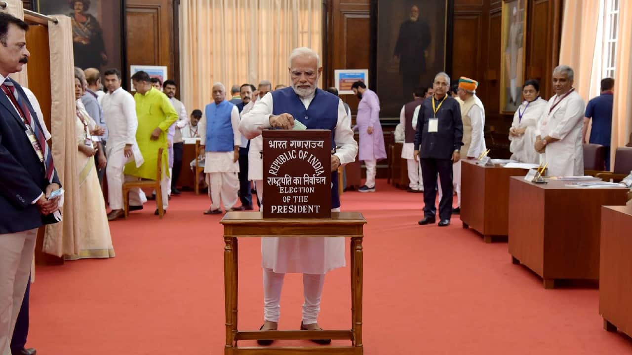 Prime Minister Narendra Modi casts his vote in the 15th Presidential election, at the Parliament. Polling to elect the 15th President of India is underway at the parliament House and the state legislative assemblies on July 18. Around 4,800 MLAs and MPs will cast their votes till 5pm for the Presidential election The NDA's presidential candidate is Draupadi Murmu whereas the Opposition candidate is Yashwant Sinha. The results will be declared on July 21 and the next President will take oath on July 25. (Image: Twitter @narendramodi)