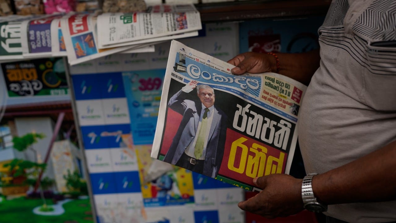 The six-time prime minister easily won the secret ballot of lawmakers on July 20 to finish the term of former President Gotabaya Rajapaksa, who fled the country after protesters stormed his residence last week and resigned. His appointment received mixed reactions, with some supporters lighting firecrackers while protesters continued to demand that he resign. (Image: AP)