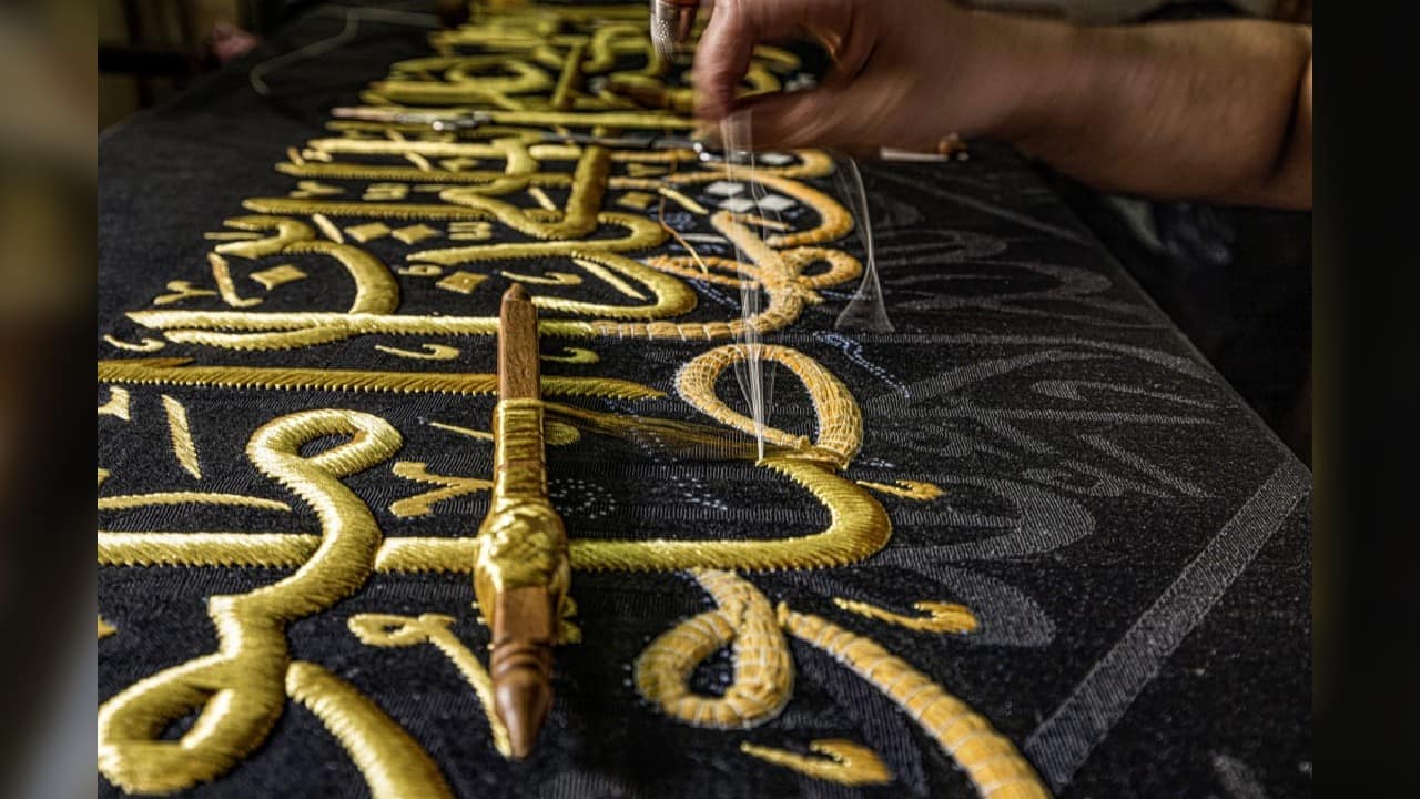 A ceremonial hanging of the kiswa, huge pieces of black silk embroidered with gold patterns, over the cubic structure that is the centrepiece of the Grand Mosque symbolises the launch of the hajj annual pilgrimage, which starts this week. (Image: AFP)