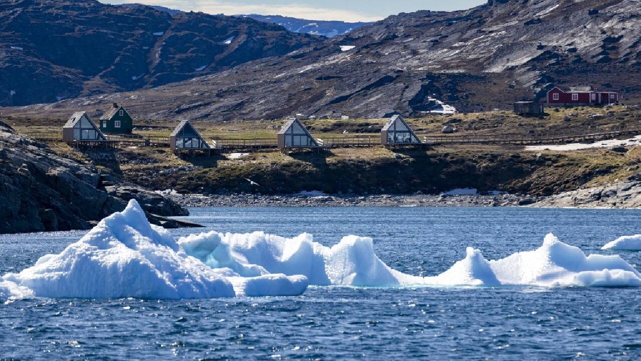 An unlikely locale for a gourmet restaurant, Ilimanaq -- Greenlandic for "place of hope" -- is home to a small community living in picturesque wooden houses, next to hiking trails and more fittingly a luxury hotel, making it an ideal stopover for wealthy tourists seeking to explore new frontiers. (Image: AFP)