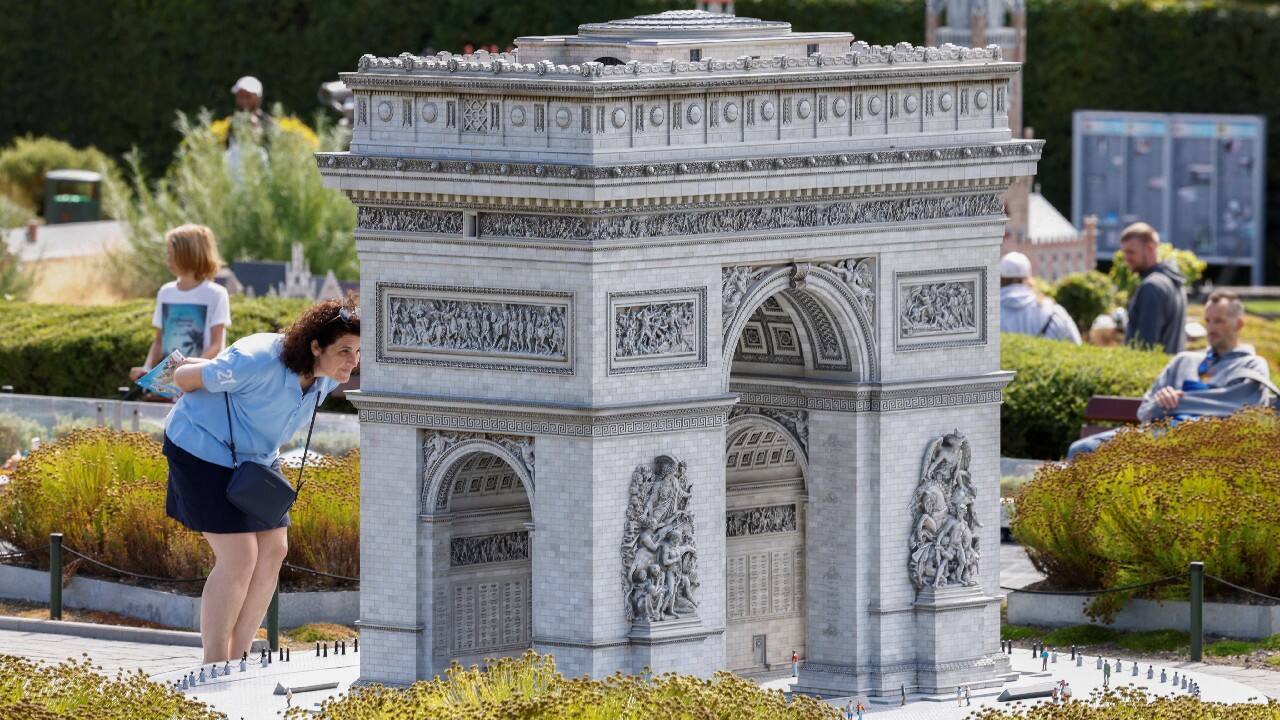 A visitor looks at a replica of Paris' Arc de Triomphe (triumphal arch) at Mini-Europe miniature park in Brussels, Belgium July 27. (Image: Reuters)