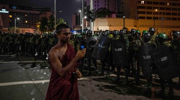 “We are the people who sent Gotabaya home, and it's not a difficult task for us to send you (Wickremesinghe) home,” said Tampitiye Sugathananda, a Buddhist monk and protest leader who was outside the presidential office. (Image: AP)