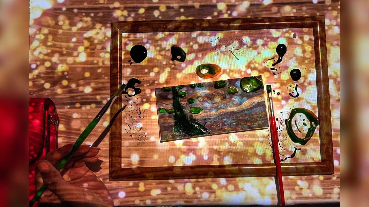 A person paints Vincent Van Gogh's &quot;The Starry Night&quot; on a bar of chocolate during &quot;Seven Paintings,&quot; an immersive food experience whereby chef Omar Sartawi collaborates with his guests to create edible pieces of art, in Dubai, United Arab Emirates, July 22. (Image: Reuters)