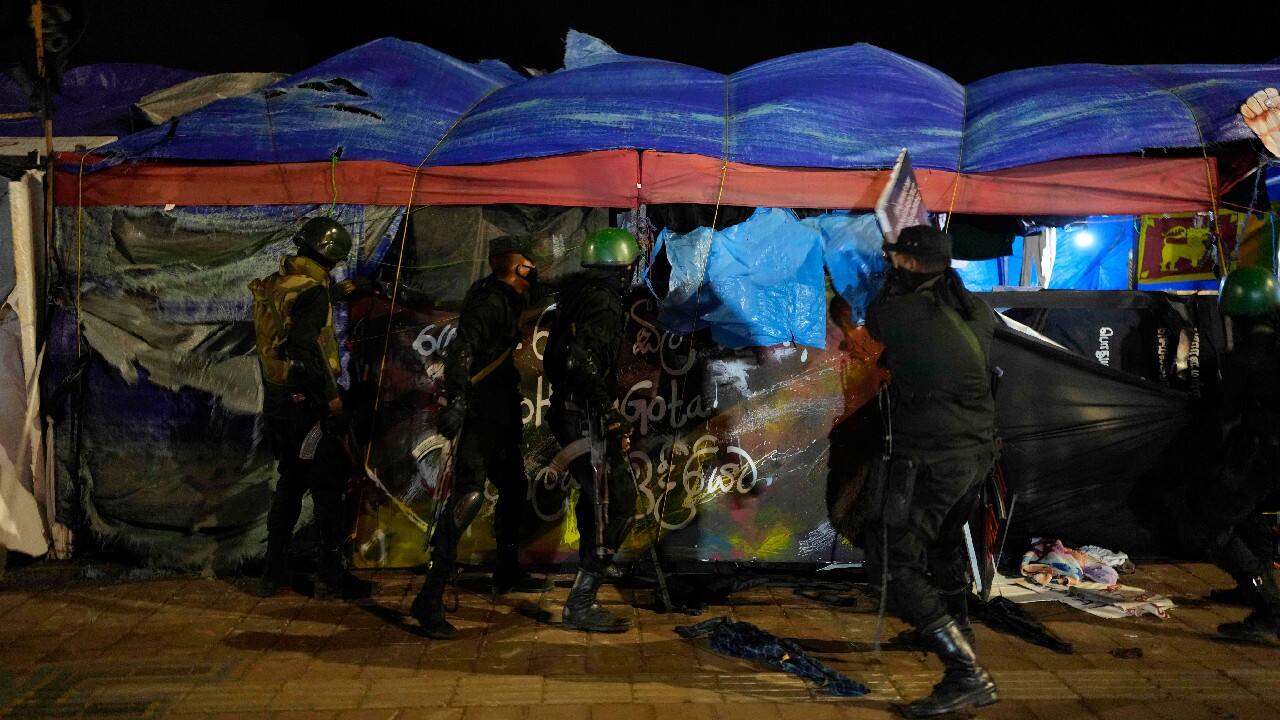 A large number of army and police personnel arrived in trucks and buses around midnight, removing tents and protest banners and making arrest. They blocked off roads leading to the site and carried long poles. Protesters said on social media that they were beaten up, but those alleged incidents couldn't be verified. (Image: AP)