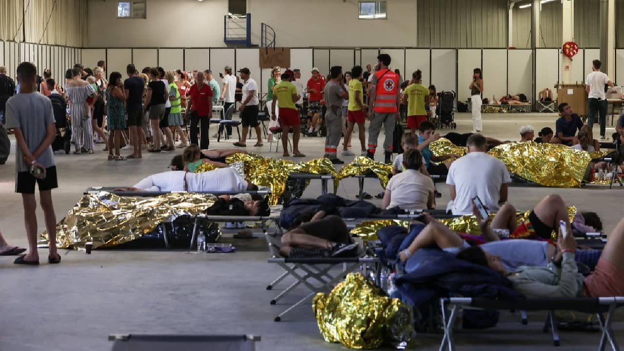 Further inland, 500 people were evacuated around the French village of Guillos as their homes came under threat from advancing fire. &quot;There were flames at the top of the trees 30 metres high,&quot; mayor Mylene Doreau told AFP. &quot;We could see them moving towards the village, it was scary.&quot; (Image: AFP)