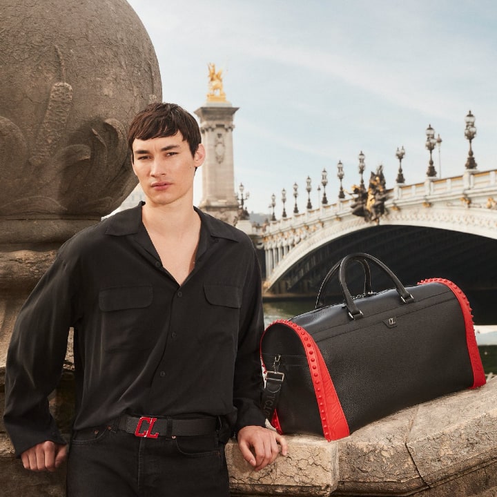 christian LOUBITON Sneakender bag in black leather and red rubber