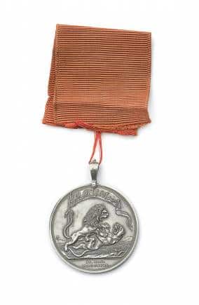 A medal issued in honour of the defeat of Tipu Sultan in 1799 shows a British lion mauling a Mysore tiger