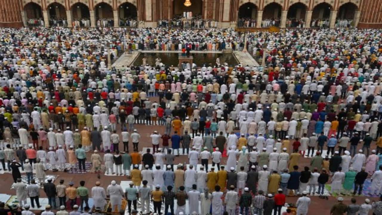 Muslim devotees offer their Eid al-Adha prayers at Jama Masjid in the old quarters of New Delhi on July 10, 2022, the feast of the sacrifice marking the end of the Hajj pilgrimage to Mecca and commemorates Prophet Abraham's readiness to sacrifice his son to show obedience to Allah. 