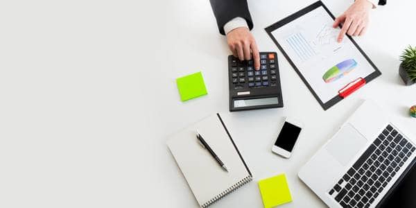 thumb_Man_using_calculator_to_evaluate_policy_returns_2x1