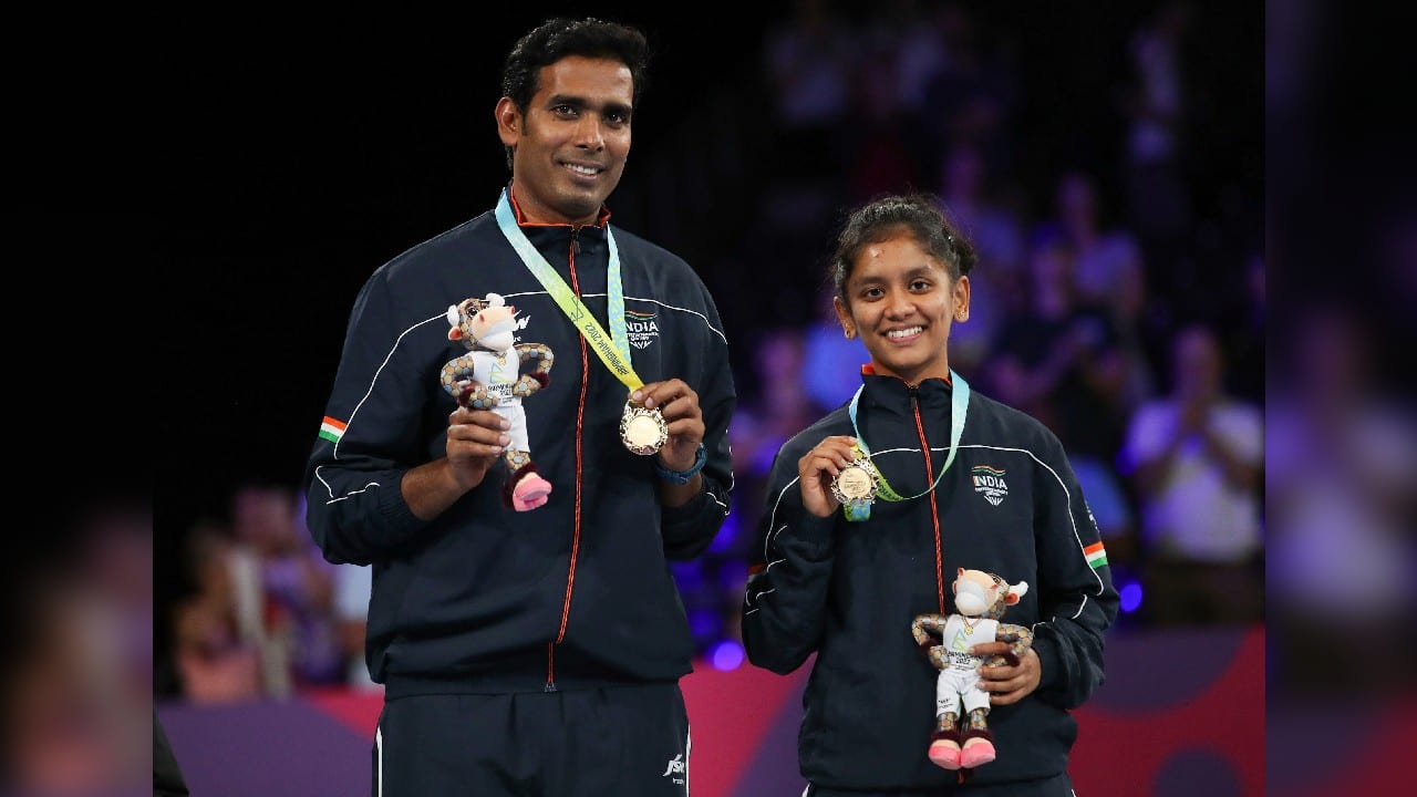 India's Gold Medallists Sharath Kamal Achanta and Sreeja Akula celebrate during the Table Tennis Mixed Doubles Medal Ceremony during the Table Tennis Women's Singles Bronze Medal match against Australia's Yangzi Liu at The NEC on day ten of the 2022 Commonwealth Games in Birmingham, England, August 7. (Image: AP)
