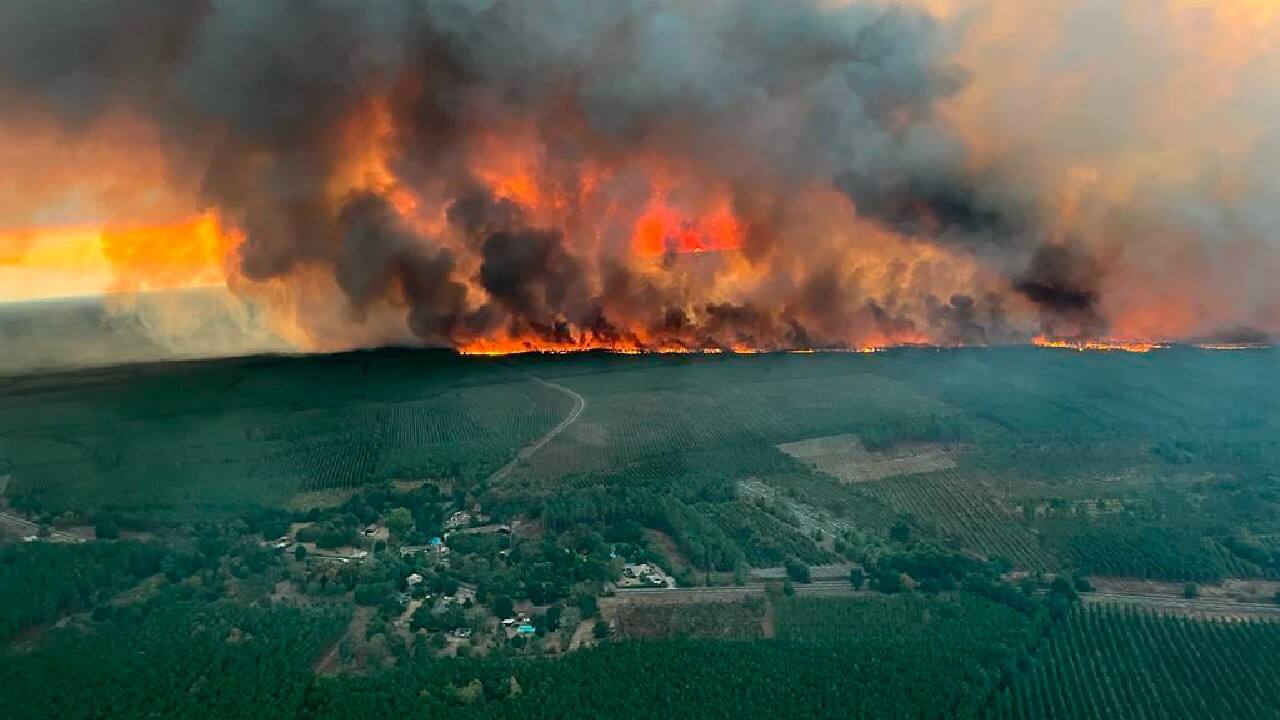 Photos released by firefighters showed flames raging through pine forests, sending clouds of dark gray smoke soaring into the sky. (Image: SDIS 33 Service Audiovisuel via AP)