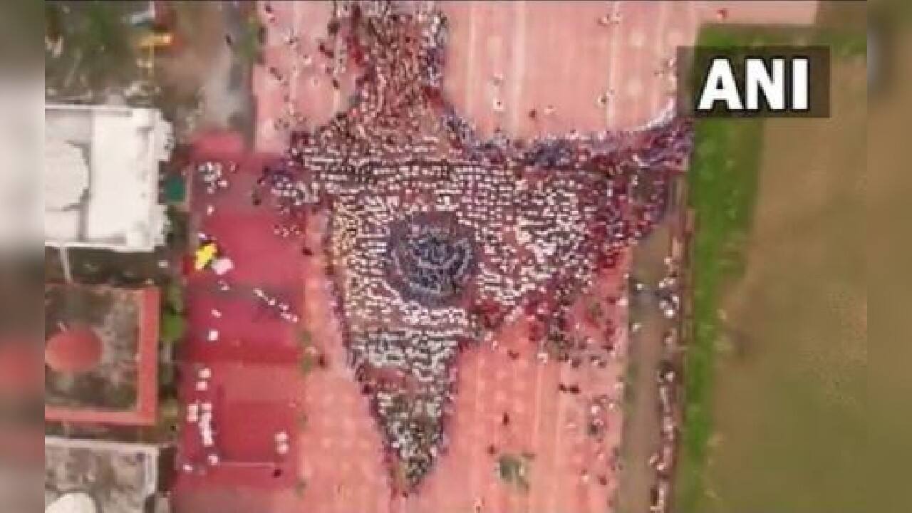 Indore city in Madhya Pradesh set a new world record on August 14 for building largest human chain forming India's geographical map by the social institution Jwala at the Divya Shaktipeet, with the cooperation of nearly 5,000 school children, social workers and other individuals. (Image: Twitter @ANI)