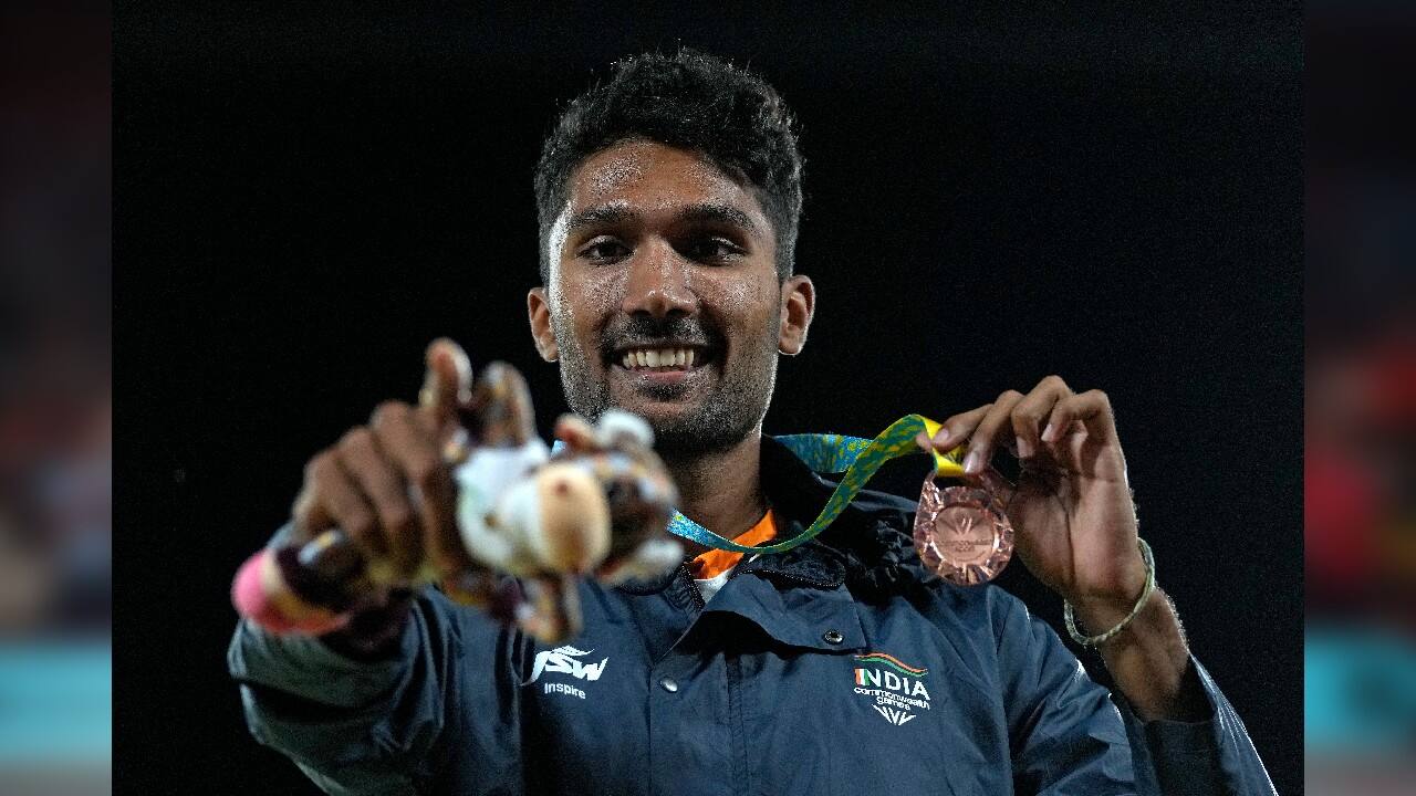 Tejaswin Shankar, bronze, celebrates during the medal ceremony for the men's high jump during the athletics in the Alexander Stadium at the Commonwealth Games in Birmingham, England, August 3. (Image: Reuters)