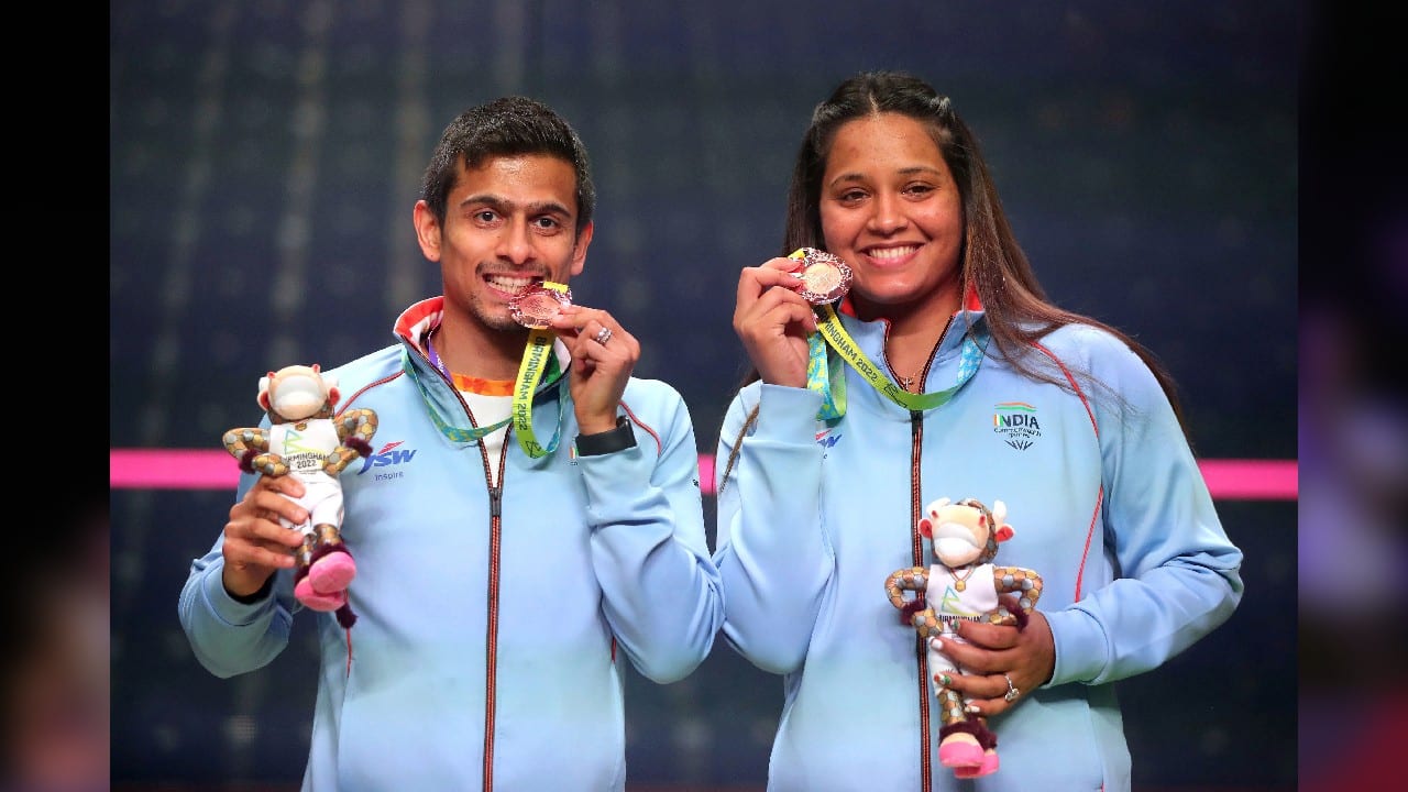 Saurav Ghosal and Dipika Pallikal Kartik pose with their bronze medals after finishing third at the University of Birmingham Hockey and Squash Centre on day ten of the 2022 Commonwealth Games in Birmingham, England, August 7. (Image: AP)