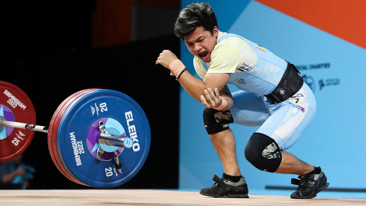 Lalrinnunga Jeremy celebrates with his Gold Medal following the Men's 67kg Final at The NEC on day three of the 2022 Commonwealth Games in Birmingham, July 31. Jeremy lifted a combined weight of 300 Kg in snatch, and clean. (Image: AP)