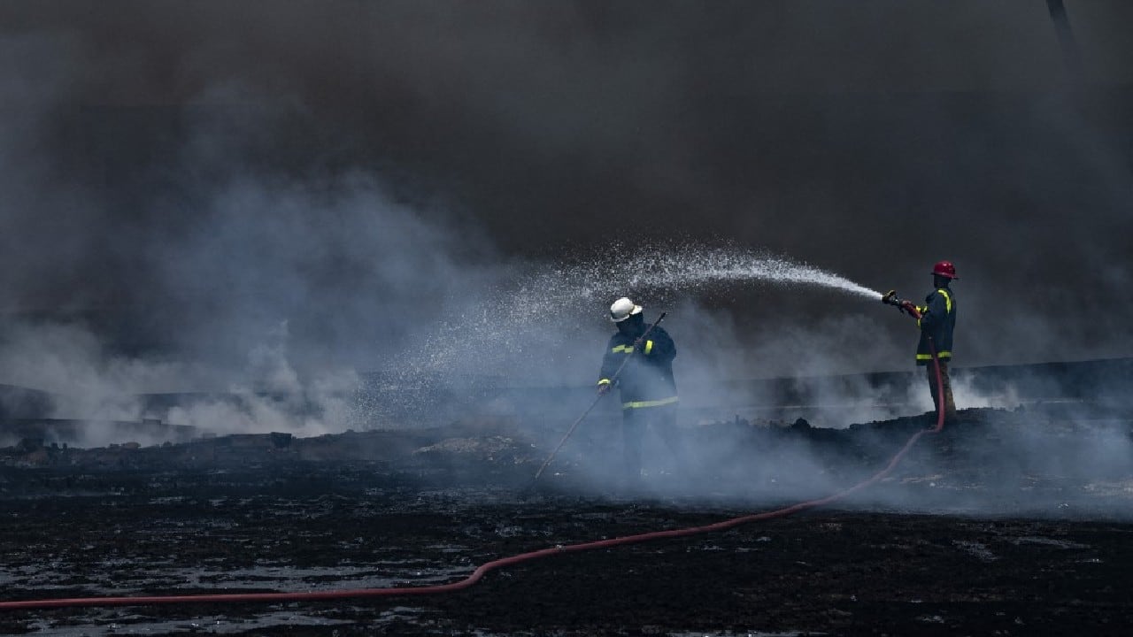 Firefighters, helicopters battle to contain Cuba fuel depot blaze