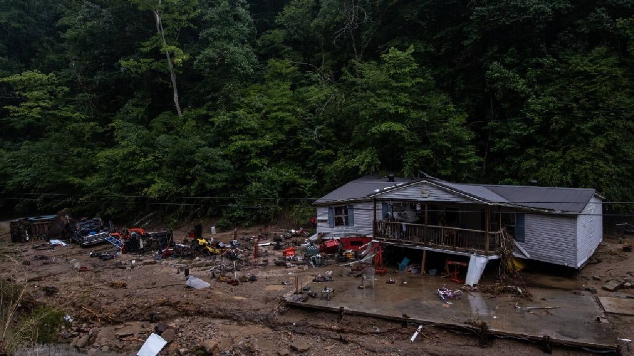 The floods hit a region of Kentucky that was already suffering from grinding poverty -- driven by the decline of the coal industry that was the heart of its economy -- taking everything from people who could least afford it. (Source: AFP)