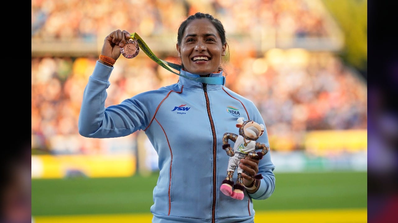 Annu Rani of India poses on the podium of after winning the bronze medal in Women's javelin throw during the athletics competition in the Alexander Stadium at the Commonwealth Games in Birmingham, England, August 7. (Image: AP)
