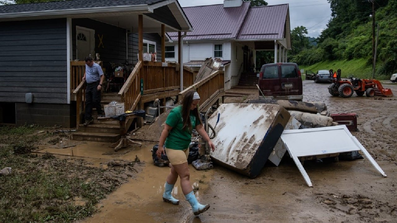 Some were distributing water bottles to those in need. A boat marked &quot;FEMA Rescue 4&quot; sat on a trailer, indicating the presence of federal emergency crews. (Source: AFP)