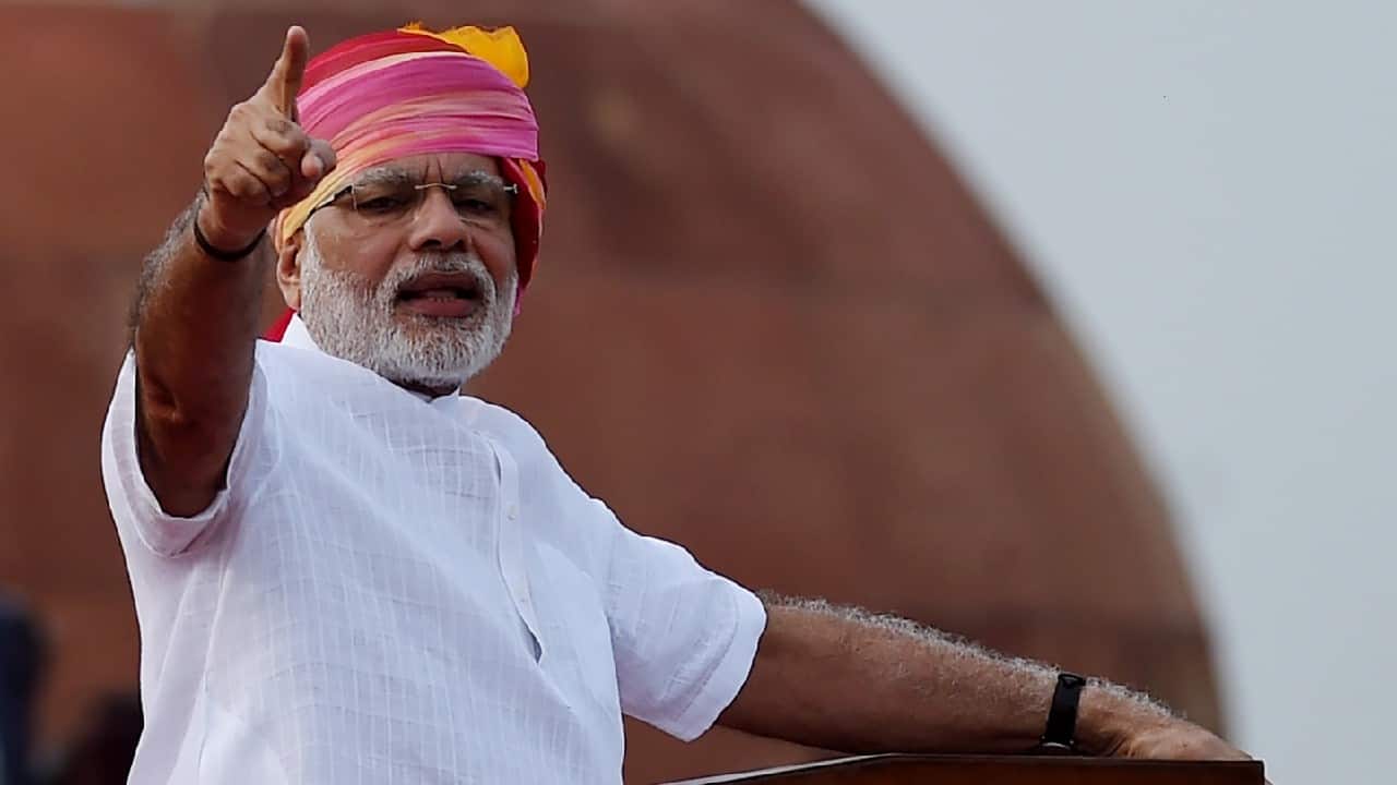 2016 | PM Modi chose to wear a pink, yellow and orange tie-and-dye turban with a multi-coloured tail which he paired with a white half-sleeved kurta. (Image: Reuters)