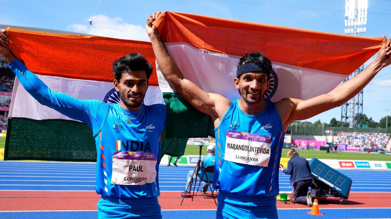 Gold medal winner Eldhose Paul, left, of India and compatriot and silver medal winner Abdulla Aboobacker Narangolintevid celebrate after the men's triple jump final during the athletics in the Alexander Stadium at the Commonwealth Games in Birmingham, England, August 7. (Image: AP)