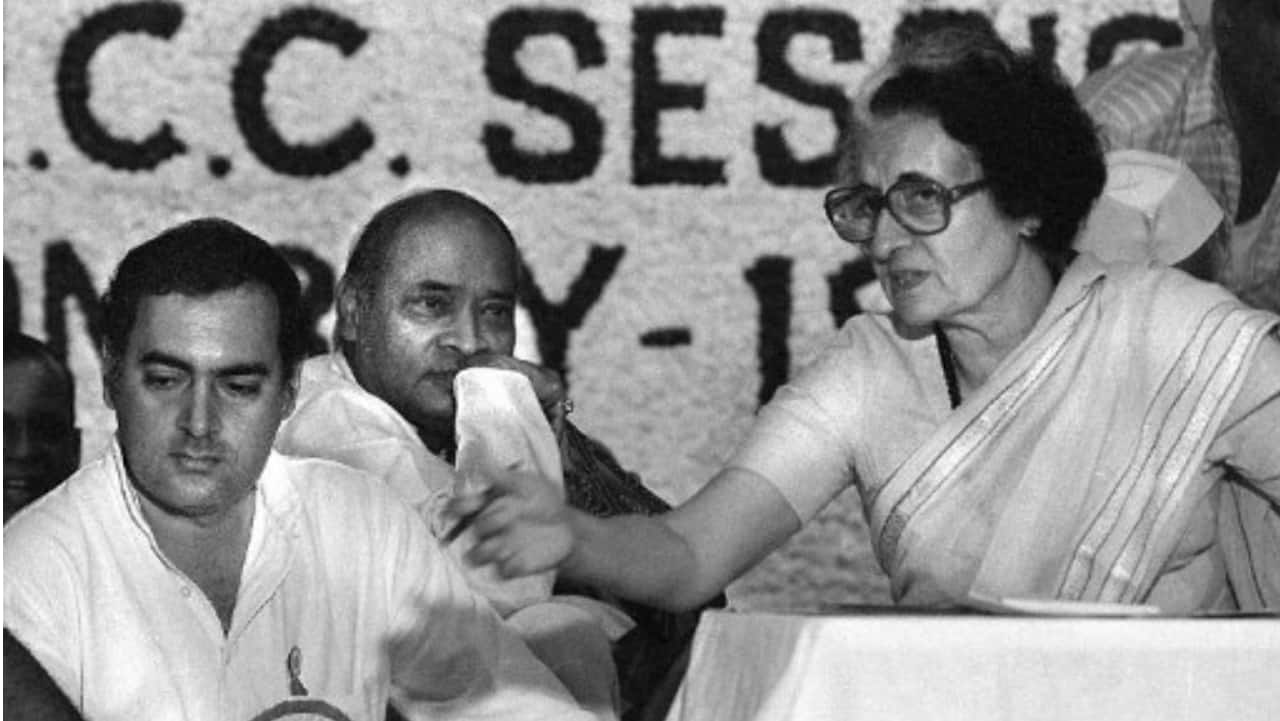 In this picture taken early 1984 shows Indian prime minister Indira Gandhi (R) and her son Rajiv (L) at a Congress Party meeting in New Delhi. 