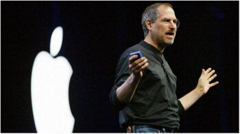 Apple co-founder and then CEO Steve Jobs in his "uniform"-- black turtleneck and Levi's classic jeans.