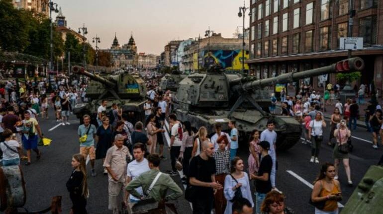 Watch: Ukrainians sing and dance as destroyed Russian tanks are paraded ...