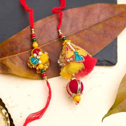 A rakhi studded with beads, and a Lumba rakhi by Shree Krishna Rakhi.