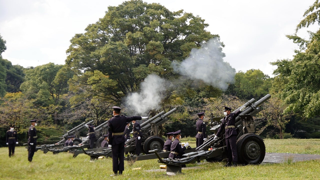 Japanese Ground Self-Defense Force personnel fire cannons at the Nippon Budokan grounds for the state funeral of former Prime Minister Shinzo Abe. (Image: AP)