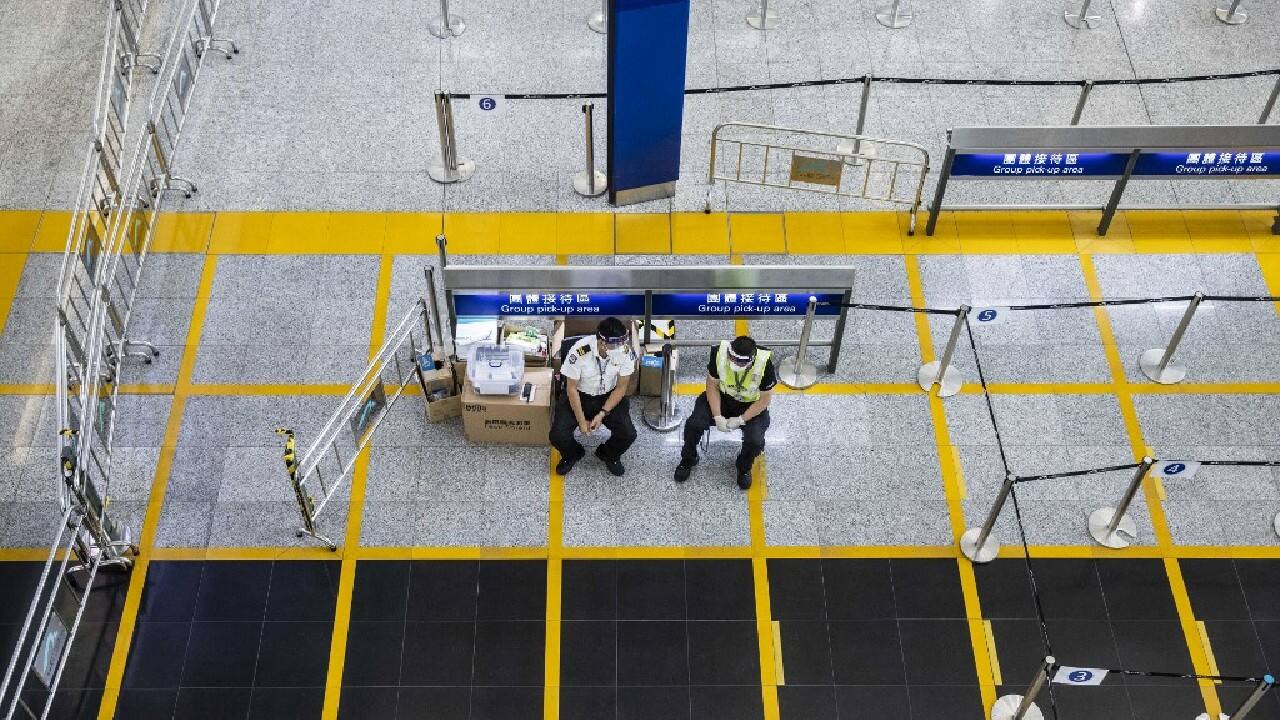 As the rest of the world reopened borders, businesses urged Hong Kong authorities to come up with an exit strategy to the pandemic in order to remain competitive amid a brain drain as tens of thousands of residents left the city. (Image: AFP)