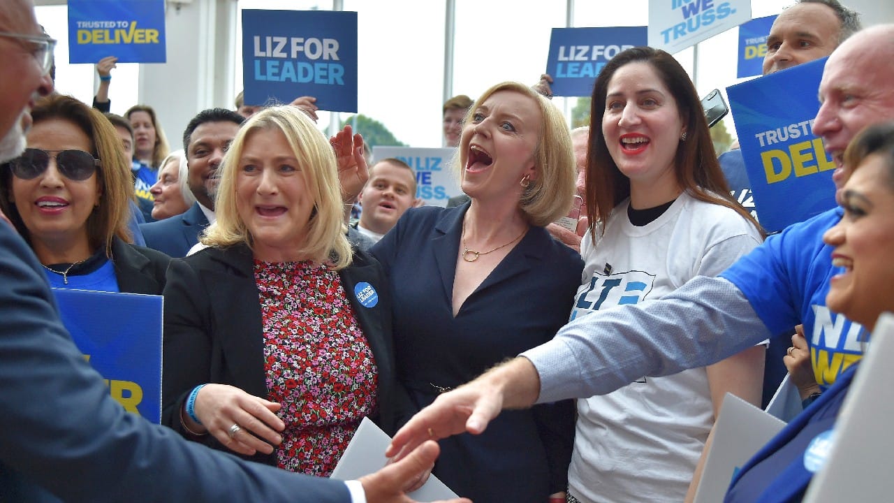 Truss was an enthusiastic member, putting up &quot;Free the Weed&quot; posters calling for decriminalization of marijuana and arguing in a speech for the abolition of the monarchy. After Oxford, Truss joined the Conservative Party - &quot;when it was distinctly unfashionable,&quot; she later said. She found employment as an economist for energy giant Shell and telecommunications company Cable and Wireless. (Image: AP)