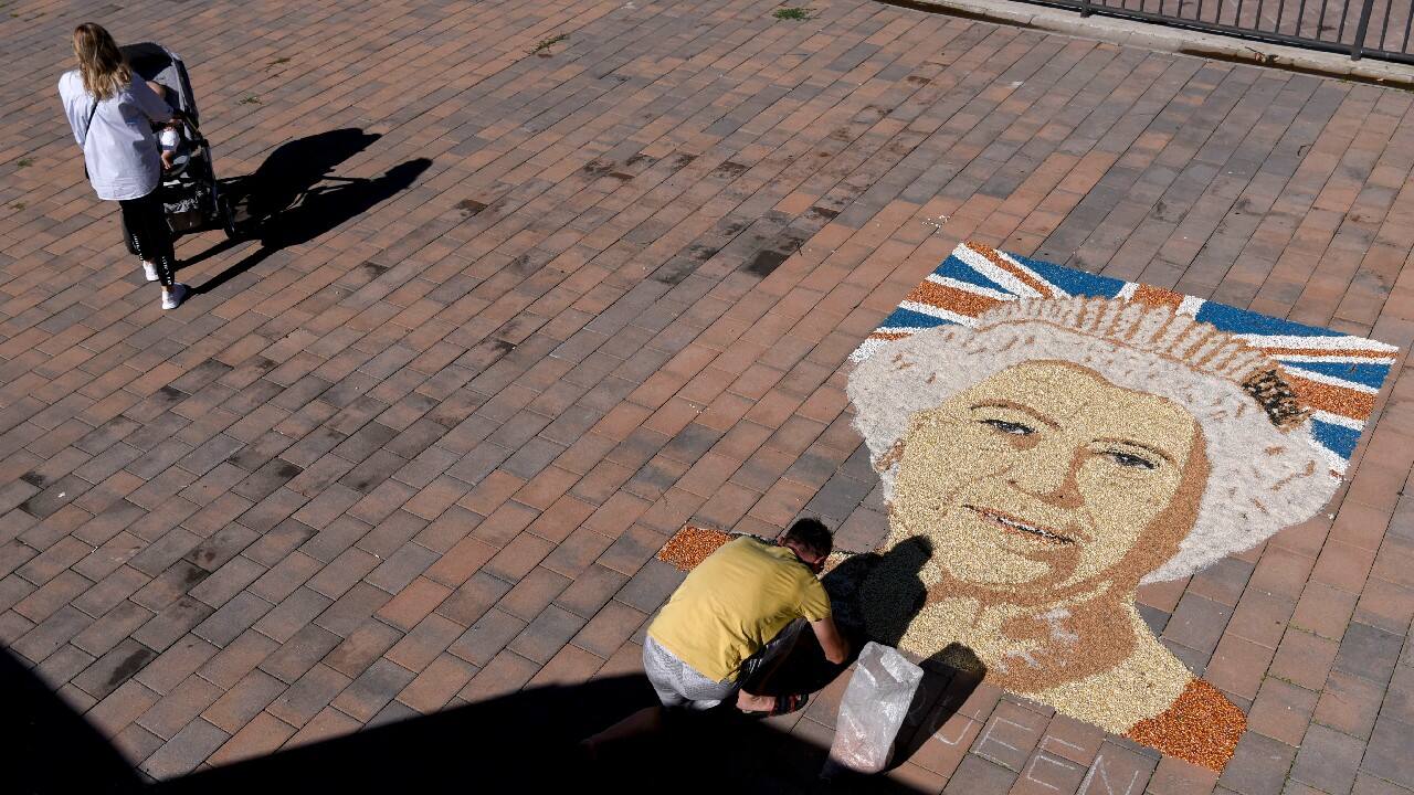 At 96, Britain’s longest-reigning monarch died September 8 after a reign of 70 years, but her visage lives on, including her world famous profile. She has borne sculptures, gallery works — a huge portrait in Kosovo made entirely of corn, peas and beans. (Source: AP)