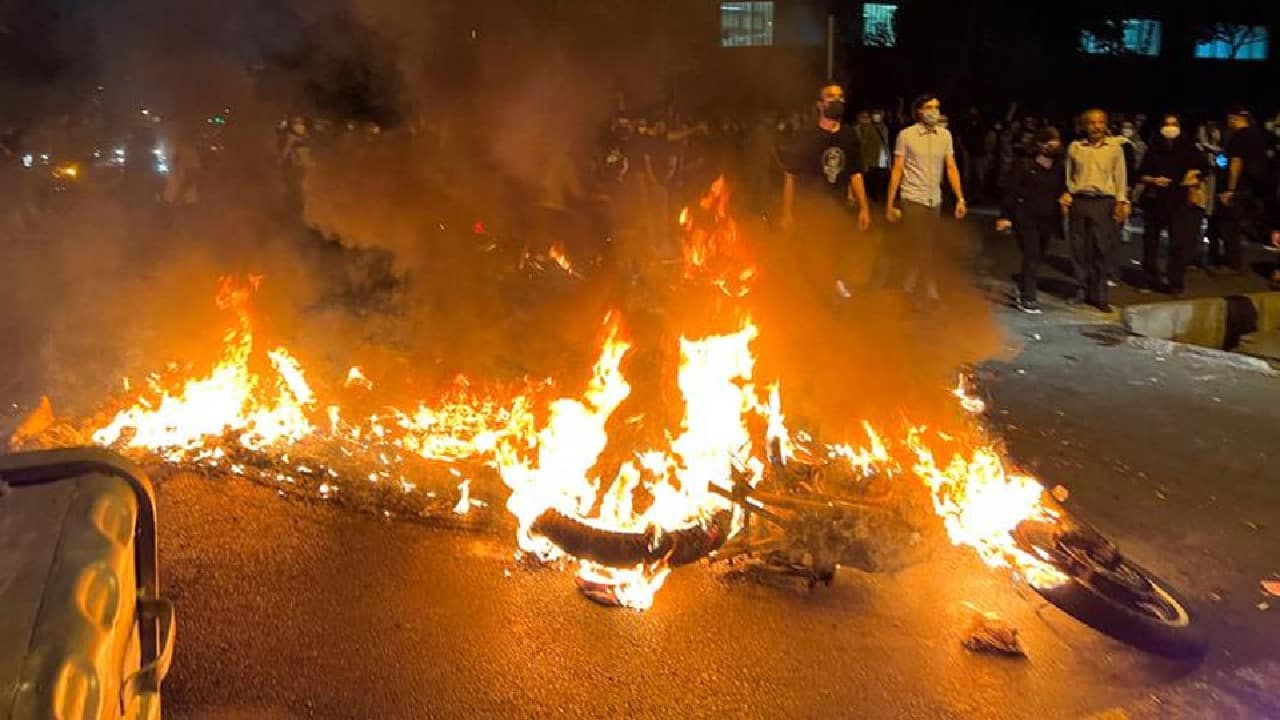 A police motorcycle burns during a protest over the death of Mahsa Amini, a woman who died after being arrested by the Islamic republic's &quot;morality police&quot;, in Tehran, Iran, September 19. (Image: Reuters)