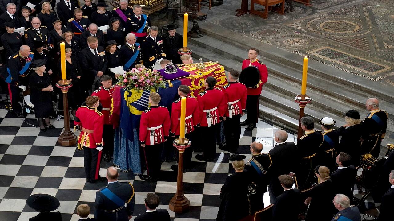 The bearer party with the coffin of Queen Elizabeth II as it is taken from Westminster Abbey, London, Monday, Sept. 19, 2022 at the end of service during the State Funeral of the late monarch. (Gareth Fuller/Pool Photo via AP)