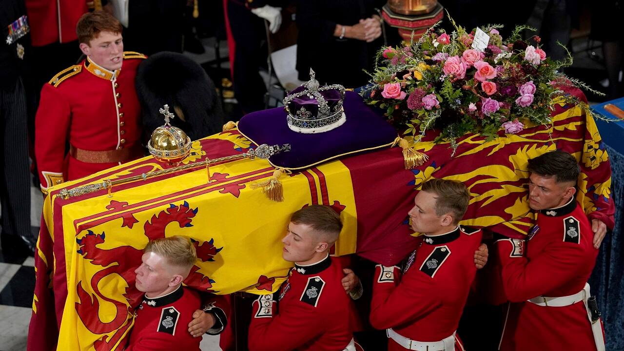 The bearer party with the coffin of Queen Elizabeth II as it is taken from Westminster Abbey, London, Monday, Sept. 19, 2022 at the end of service during the State Funeral of the late monarch. (Gareth Fuller/Pool Photo via AP)