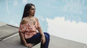 Devangi Patel, 33, a cardiothoracic anesthesiologist, in Atlanta on Sept. 7, 2022. Patel says meeting her goal of financial independence by her 50s is proving more challenging than she expected, in part because she is paying off about $250,000 in medical school loans. (Audra Melton/The New York Times)