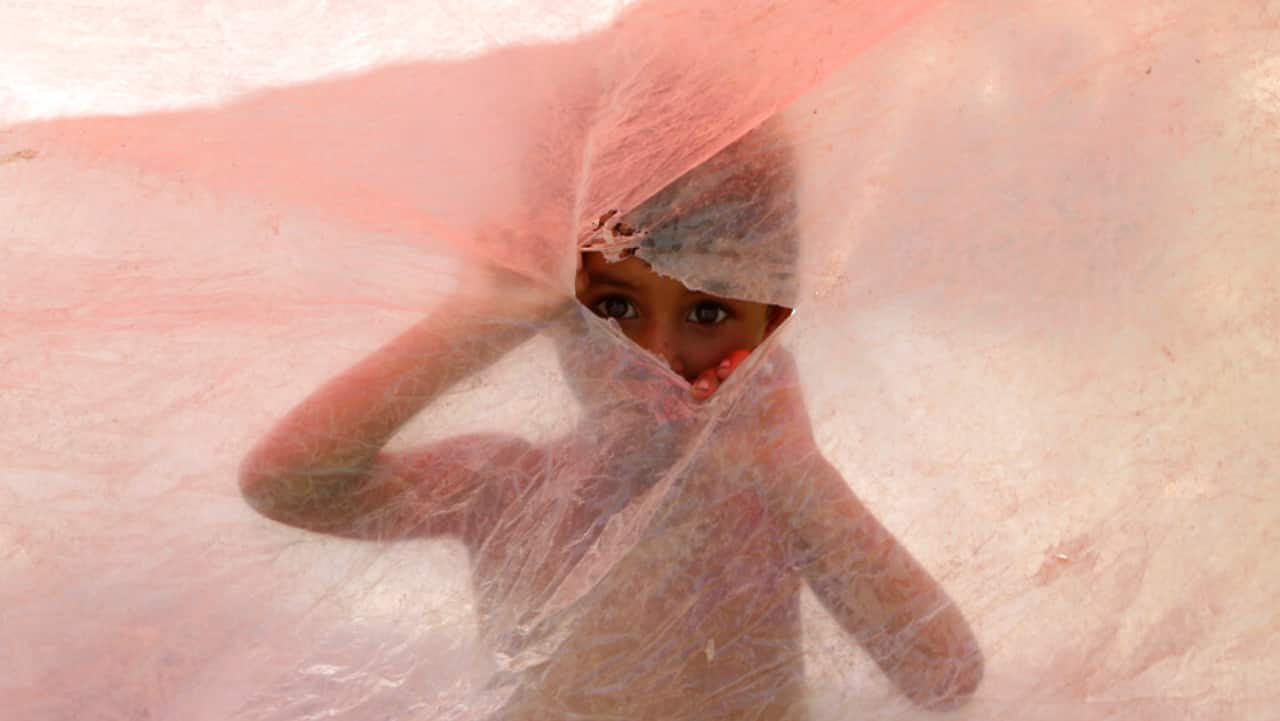 Flash flooding from the heavy rains has washed away villages and crops as soldiers and rescue workers evacuated stranded residents to the safety of relief camps and provided food to thousands of displaced Pakistanis. 