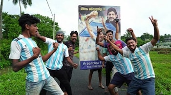 Fans of Argentina celebrate after winning the Conmebol 2021 Copa America football tournament final match against Brazil, in Kurumassery village, about 40 km from Kochi, in Kerala.
