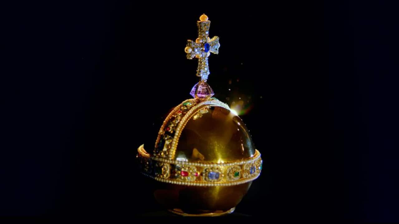 The orb represents the monarch's power and the Christian world. The gold piece of jewellery is surrounded by a band of diamonds, emeralds, rubies, sapphire and pearls and topped with amethyst and a cross. It is 27.5 centimetres high and weighs 1,320 grams. (Image credit: Historic Royal Palaces)