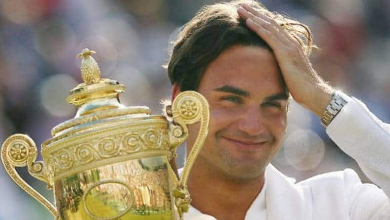 Roger Federer holds the trophy after defeating Rafael Nadal of Spain during the final of the Wimbledon Tennis Championships in Wimbledon, in south London, 08 July 2007. Federer won the Wimbledon men's singles title for the fifth successive year with a 7-6 (9/7), 4-6, 7-6 (7/3), 2-6, 6-2 victory over Nadal.