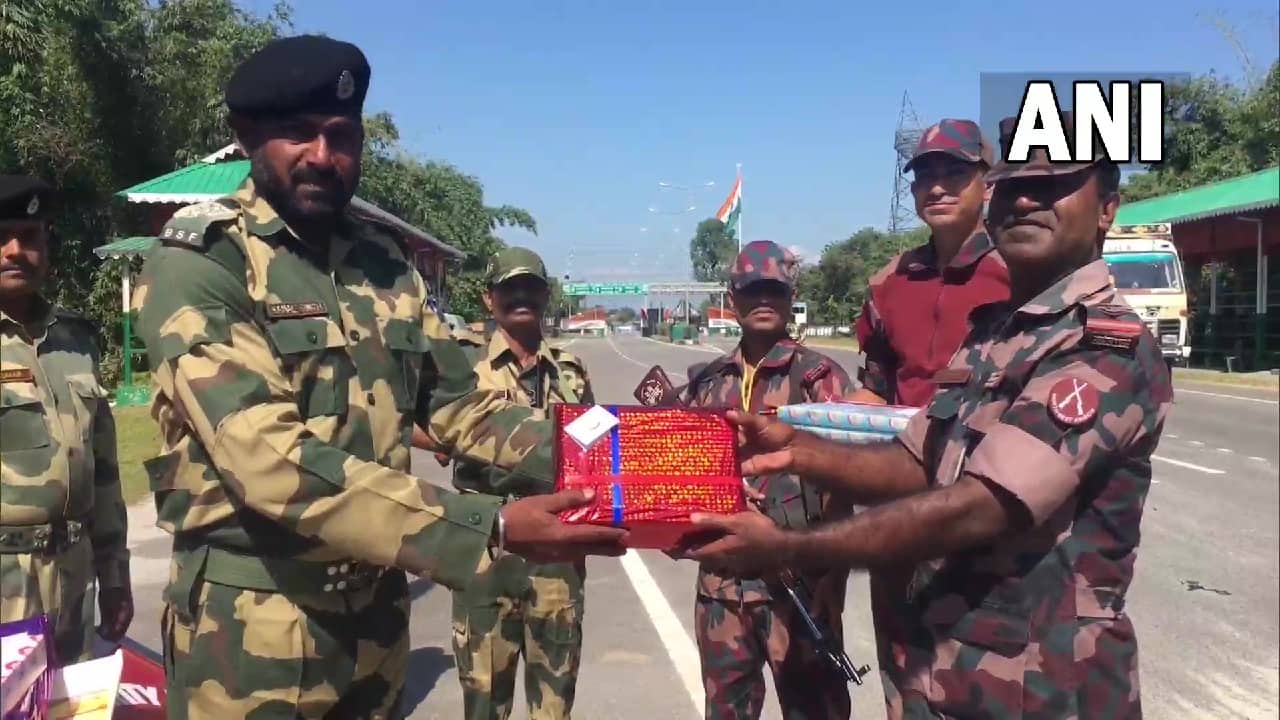 The exchange of sweets took place between BSF 176 Battalion and 18 BGB at the border at Fulbari, India-Bangladesh border near Siliguri. (Image: Twitter @ANI)