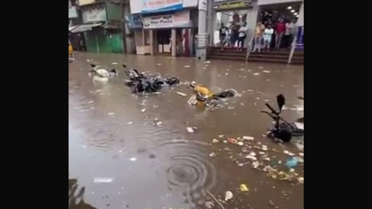 In Pics | Heavy rain creates havoc in Bengaluru: Roads flooded, cars ...